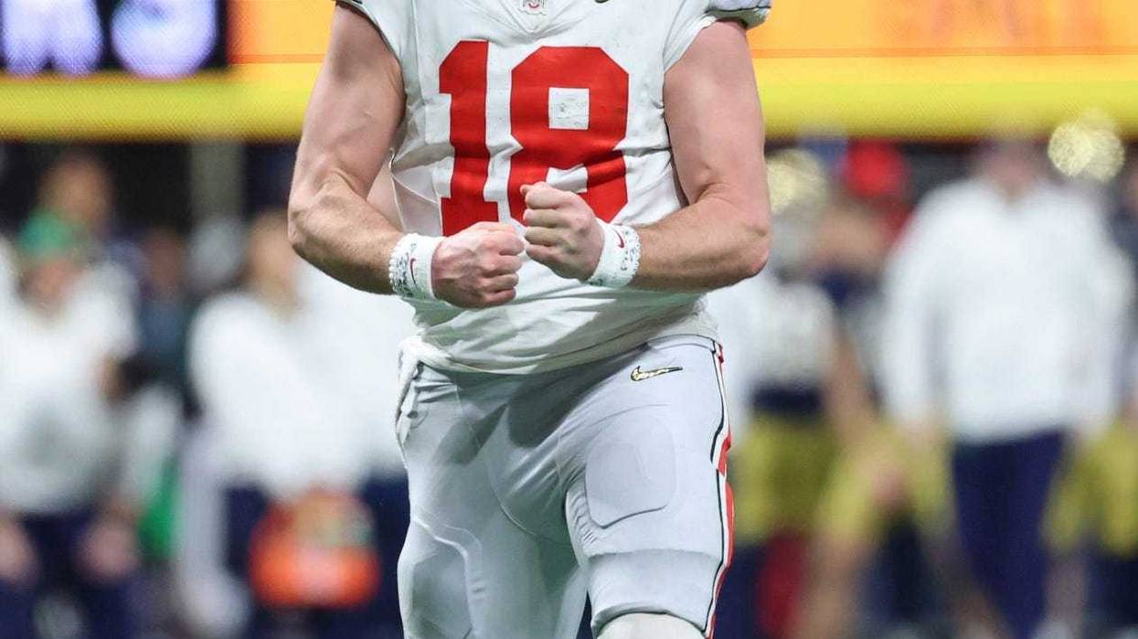 Jan 20, 2025; Atlanta, GA, USA; Ohio State Buckeyes quarterback Will Howard (18) reacts after a play against the Notre Dame Fighting Irish during the second half the CFP National Championship college football game at Mercedes-Benz Stadium.
