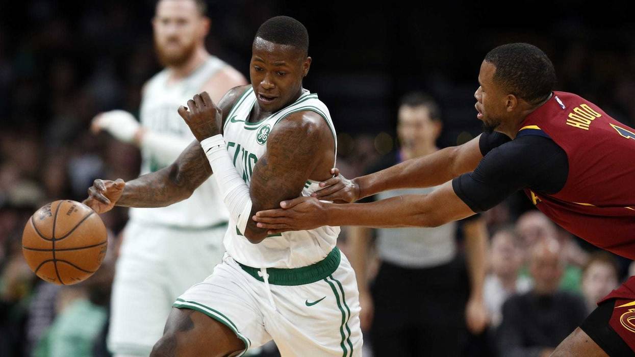 Jan 23, 2019; Boston, MA, USA; Boston Celtics guard Terry Rozier (12) tries to evade Cleveland Cavaliers guard Rodney Hood (1) during the first half at TD Garden. Mandatory Credit: Greg M. Cooper-USA TODAY Sports