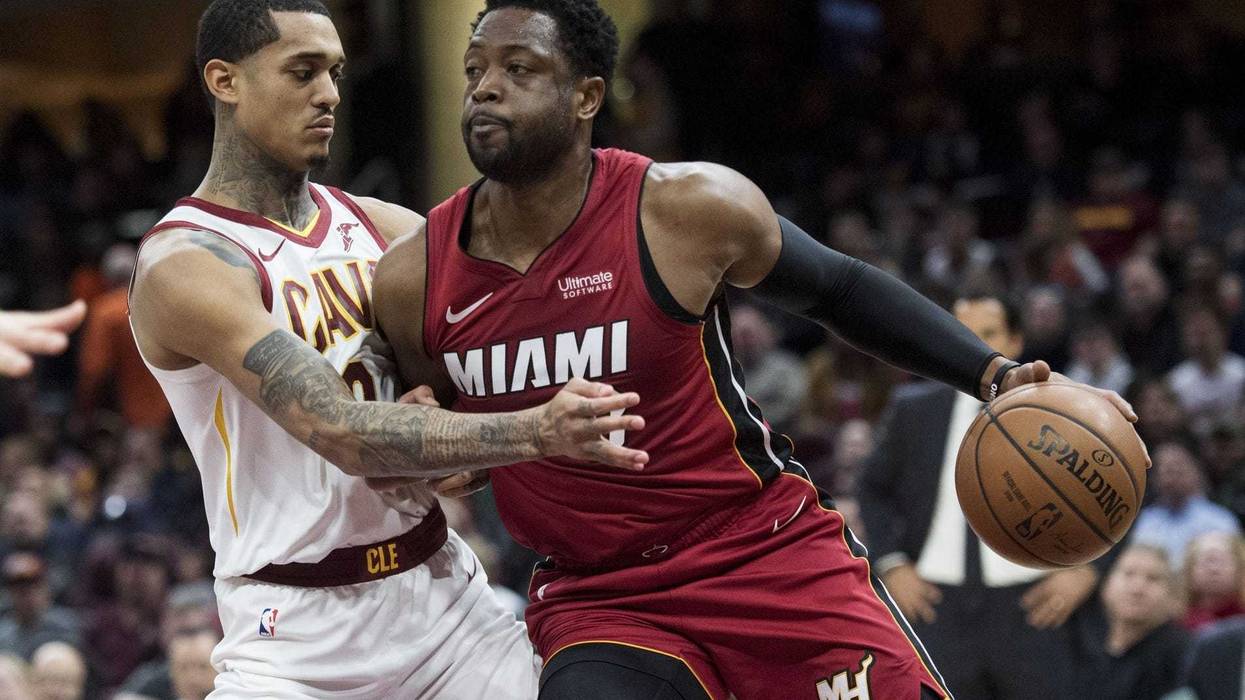 Jan 25, 2019; Cleveland, OH, USA; Miami Heat guard Dwyane Wade (3) drives to the basket against Cleveland Cavaliers guard Jordan Clarkson (8) during the first half at Quicken Loans Arena. Mandatory Credit: Ken Blaze-USA TODAY Sports
