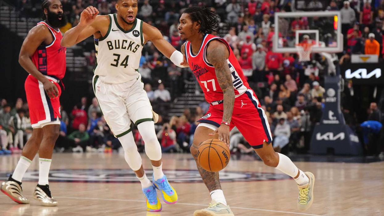 Jan 25, 2025; Inglewood, California, USA; LA Clippers guard Kevin Porter Jr. (77) dribbles the ball against Milwaukee Bucks forward Giannis Antetokounmpo (34) in the first half at Intuit Dome. Mandatory Credit: Kirby Lee-Imagn Images