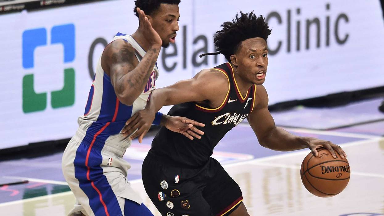 Jan 27, 2021; Cleveland, Ohio, USA; Cleveland Cavaliers guard Collin Sexton (2) dribbles against Detroit Pistons guard Delon Wright (55) during the first quarter at Rocket Mortgage FieldHouse.