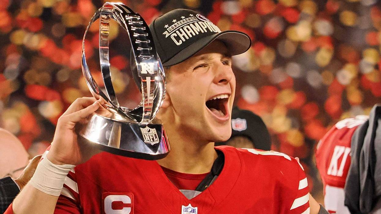 Jan 28, 2024; Santa Clara, California, USA; San Francisco 49ers quarterback Brock Purdy (13) holds the George Halas Trophy while after winning the NFC Championship football game against the Detroit Lions at Levi's Stadium.