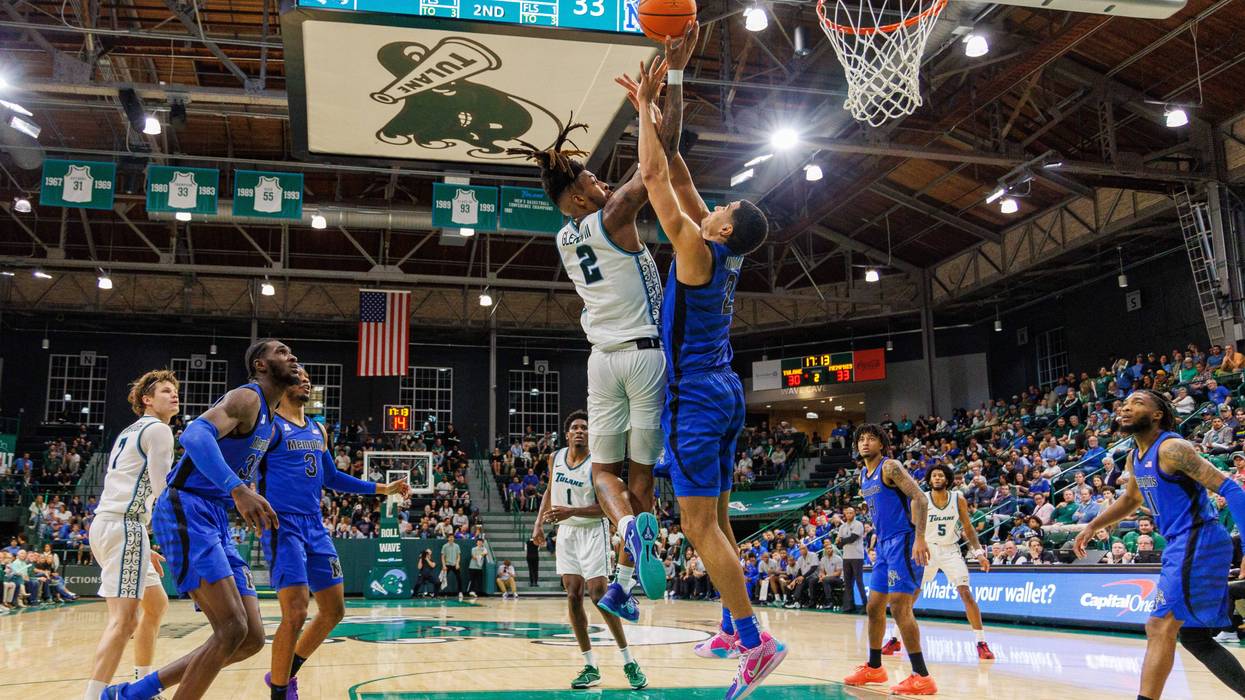 Jan 30, 2025; New Orleans, Louisiana, USA; Tulane Green Wave forward Greg Glenn III (2) drives to the basket against Memphis Tigers forward Nicholas Jourdain (2) during the second half at Avron B. Fogelman Arena in Devlin Fieldhouse. The university announced July 28 that Glenn had been killed in an accident.
