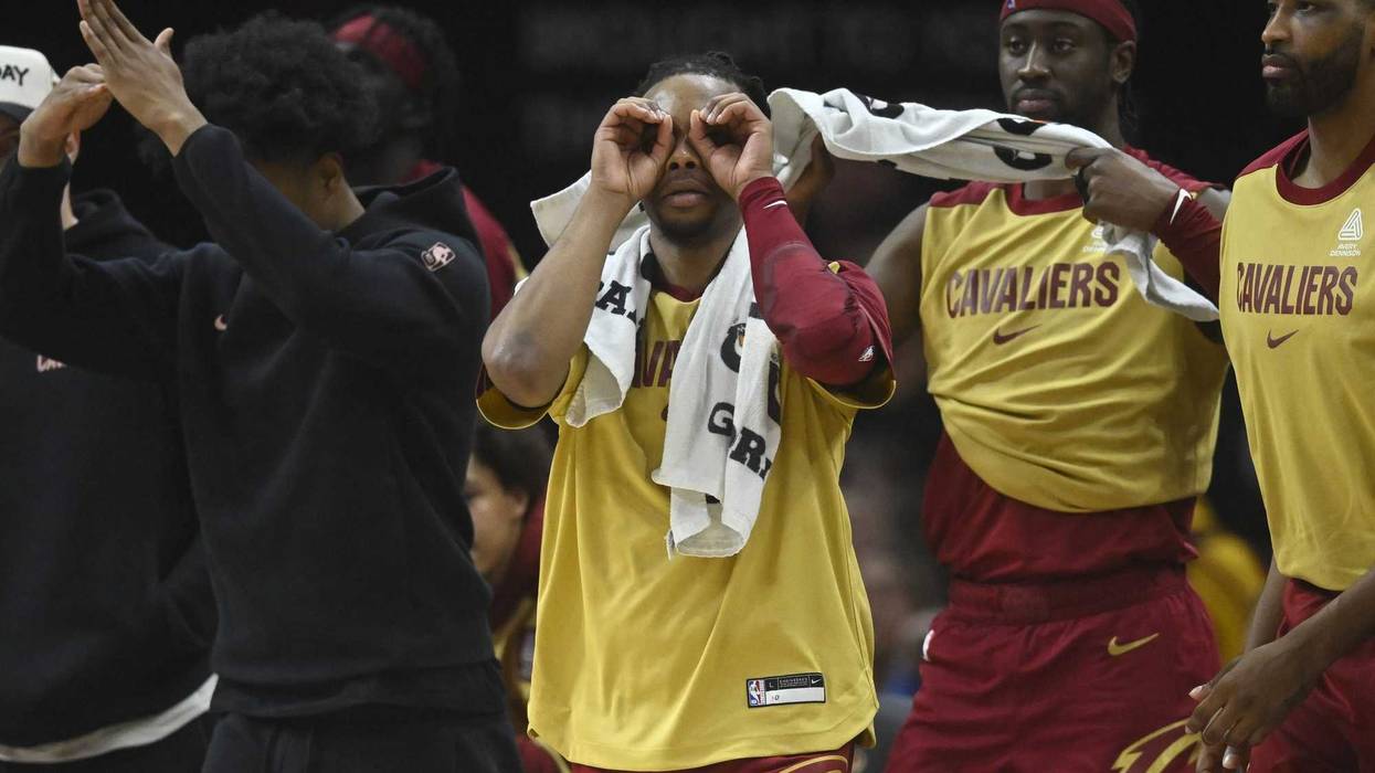 Jan 5, 2025; Cleveland, Ohio, USA; Cleveland Cavaliers guard Darius Garland (second from left) reacts in the second quarter against the Charlotte Hornets at Rocket Mortgage FieldHouse.