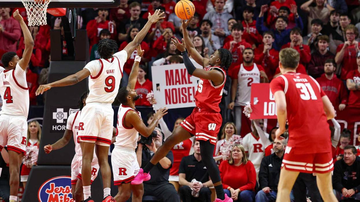 Jan 6, 2025; Piscataway, New Jersey, USA; Wisconsin Badgers guard John Blackwell (25) makes a basket during the second half against Rutgers Scarlet Knights forward Dylan Grant (9) at Jersey Mike's Arena. Mandatory Credit: Vincent Carchietta-Imagn Images