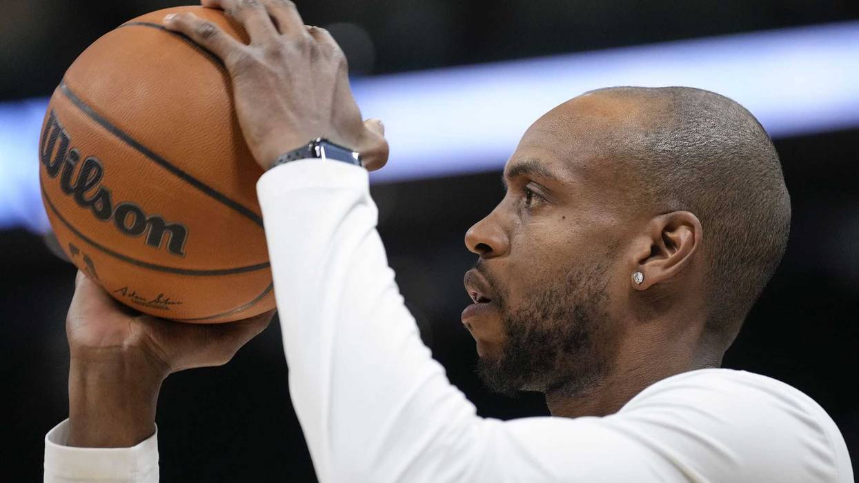 Jan 8, 2025; Milwaukee, Wisconsin, USA; Milwaukee Bucks forward Khris Middleton (22) shoots during warmups prior to the game against the San Antonio Spurs at Fiserv Forum. Mandatory Credit: Jeff Hanisch-Imagn Images