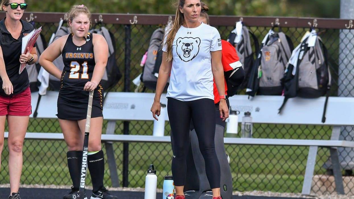 Janelle Benner (right) watches from the sidelines as head field hockey coach at Ursinus College.