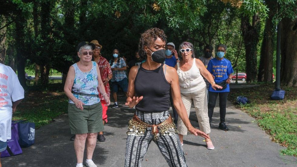 Janet Ford leads exercise Tuesday at Philadelphia Senior Fun Day, held at Fairmount Park.