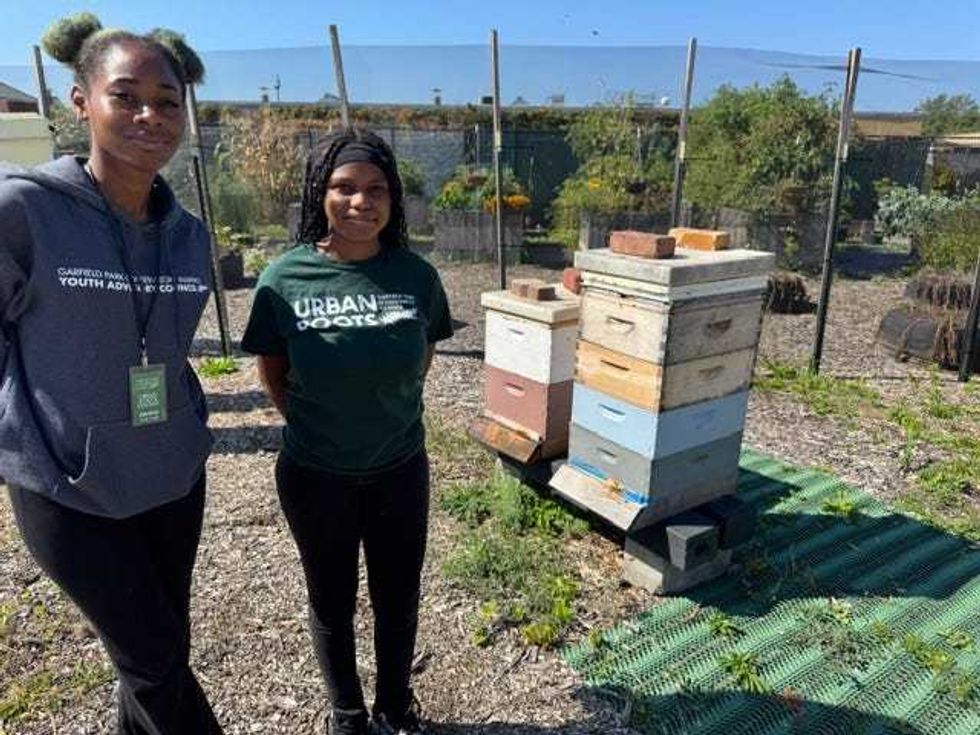 Janice Zolicoffer (left), London Ruffin (right) cultivate honey from their bee hives