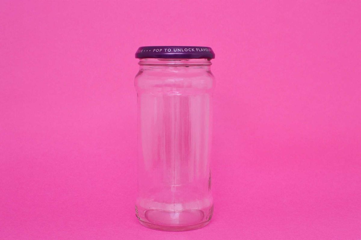 Jar on pink background stock photo.
