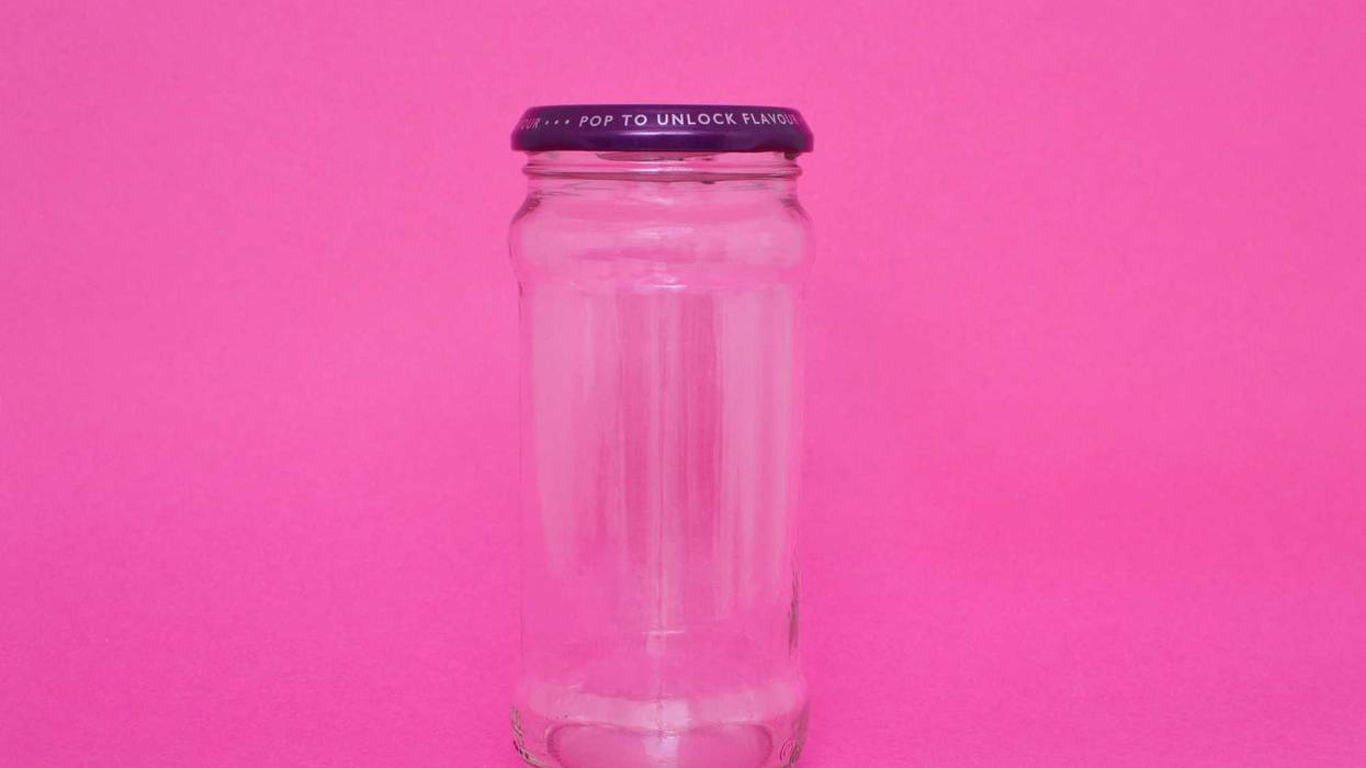 Jar on pink background stock photo.