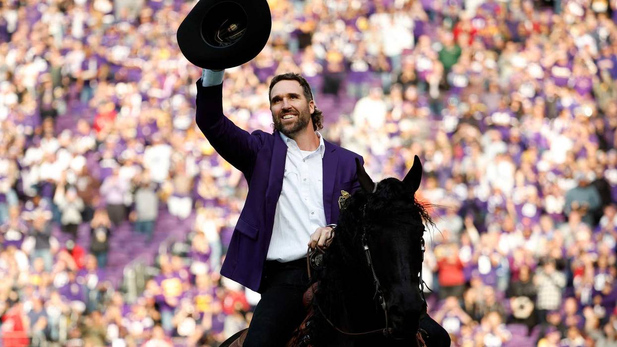 Jared Allen, former defensive end of the Minnesota Vikings, celebrates as he is inducted into the Vikings' Ring of Honor during halftime at U.S. Bank Stadium on October 30, 2022 in Minneapolis, Minnesota.