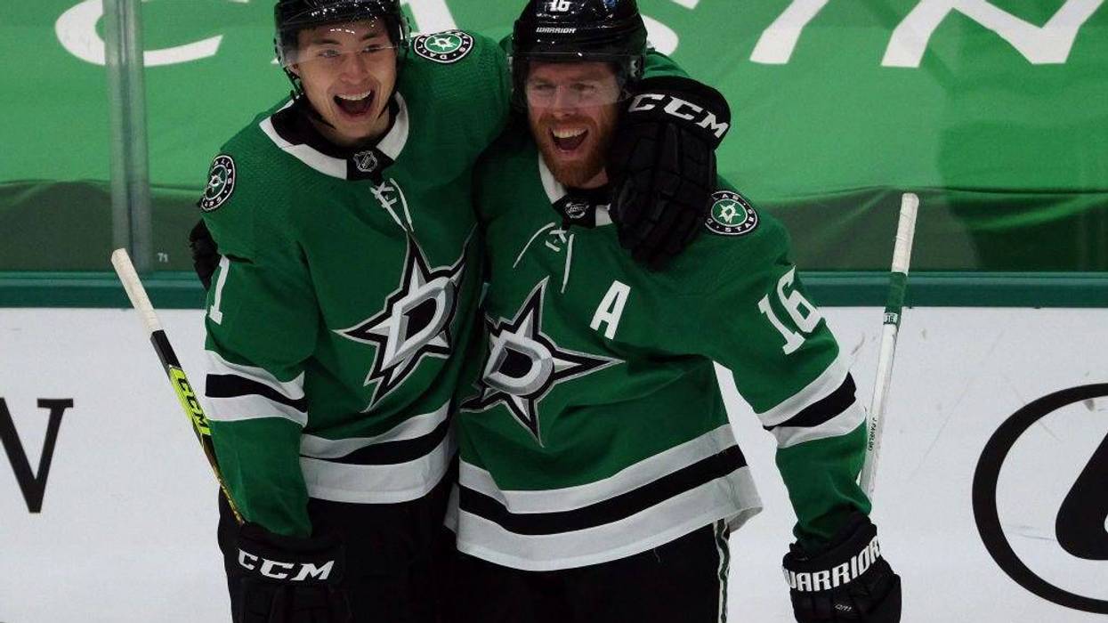 Jason Robertson #21 and Joe Pavelski #16 of the Dallas Stars celebrate a goal against the Chicago Blackhawks in the second period at American Airlines Center on March 09, 2021