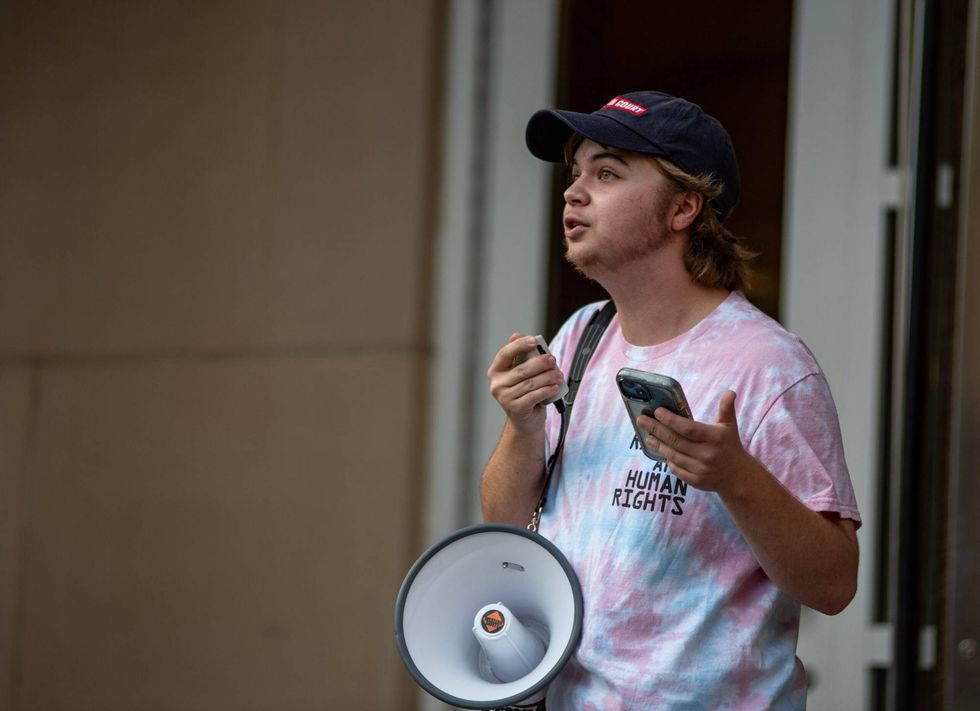 Jay Castilow, standing outside Columbia City Hall, describes his emotions as he received news that his doctor would no longer prescribe hormone-replacement therapy to minors