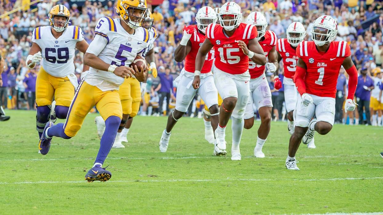 Jayden Daniels scores a touchdown as the LSU Tigers take on the Ole Miss Rebels
