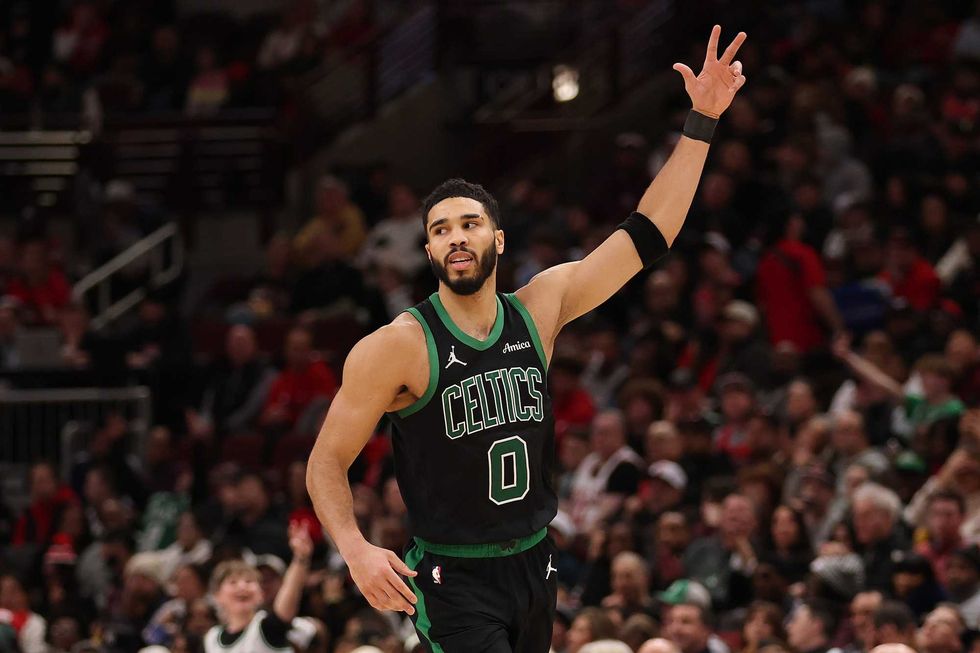 Jayson Tatum #0 of the Boston Celtics celebrates a three pointer against the Chicago Bulls during the second half at the United Center on December 21, 2024 in Chicago, Illinois.