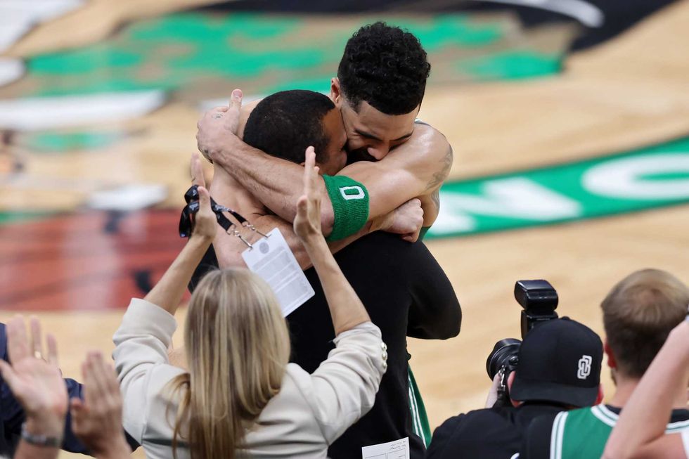 Jayson Tatum #0 of the Boston Celtics hugs head coach Joe Mazzulla of the Boston Celtics during the fourth quarter of Game Five of the 2024 NBA Finals against the Dallas Mavericks at TD Garden on June 17, 2024 in Boston, Massachusetts.