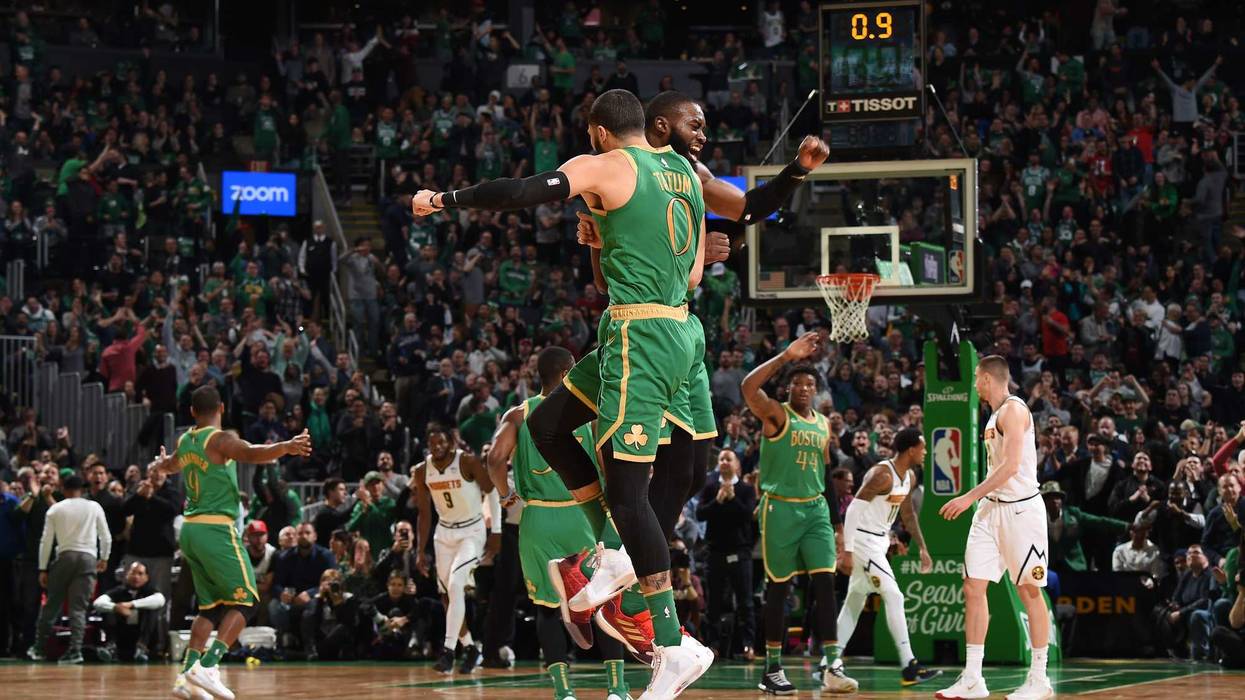 Jayson Tatum and Jaylen Brown celebrate against the Denver Nuggets