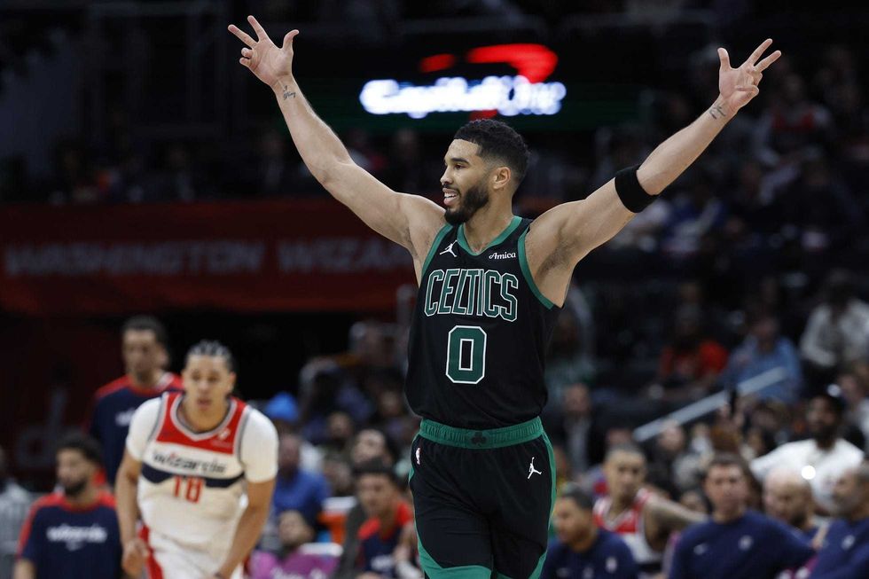 Jayson Tatum celebrates after making a three-pointer against the Washington Wizards on Thursday night.