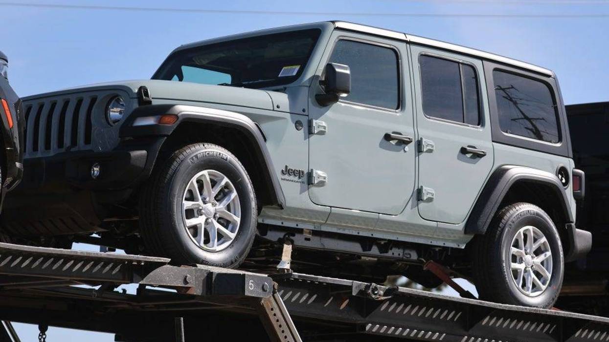 Jeeps are trucked into a lot on the grounds of the Belvidere Assembly Plant on February 26, 2023 in Belvidere, Illinois.