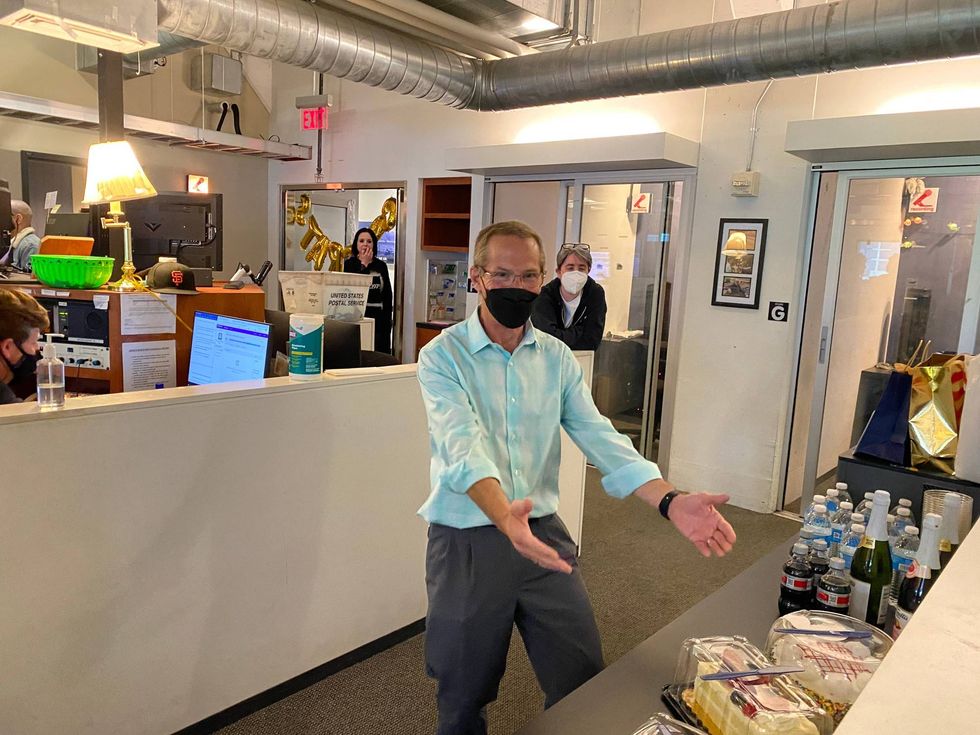 Jeff Bell in the KCBS Radio newsroom, celebrating his final day before retirement.