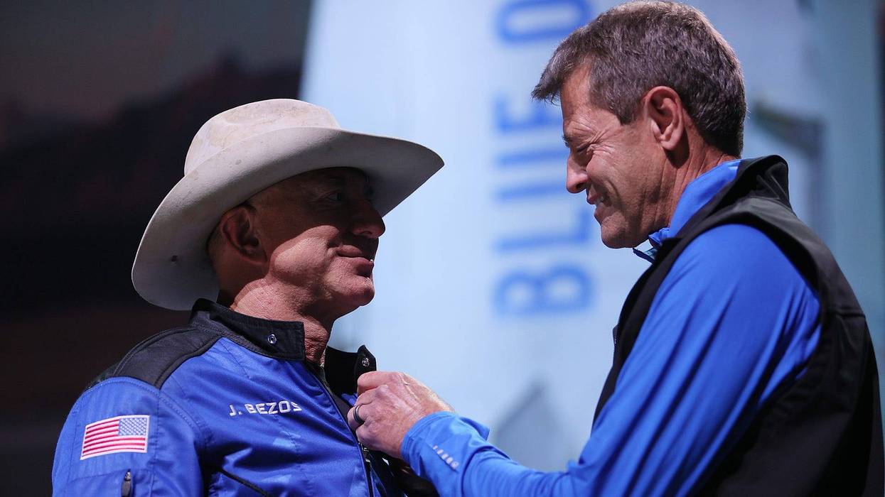 Jeff Bezos receives wings from Blue Origin’s Jeff Ashby