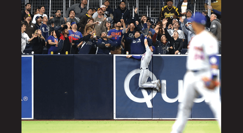 Jeff McNeil #6 of the New York Mets is unable to reach a solo homerun hit by Hunter Renfroe #10 of the San Diego Padres during the fifth inning of a game against the New York Mets at PETCO Park on May 06, 2019 in San Diego, California. (Photo by Sean M. H