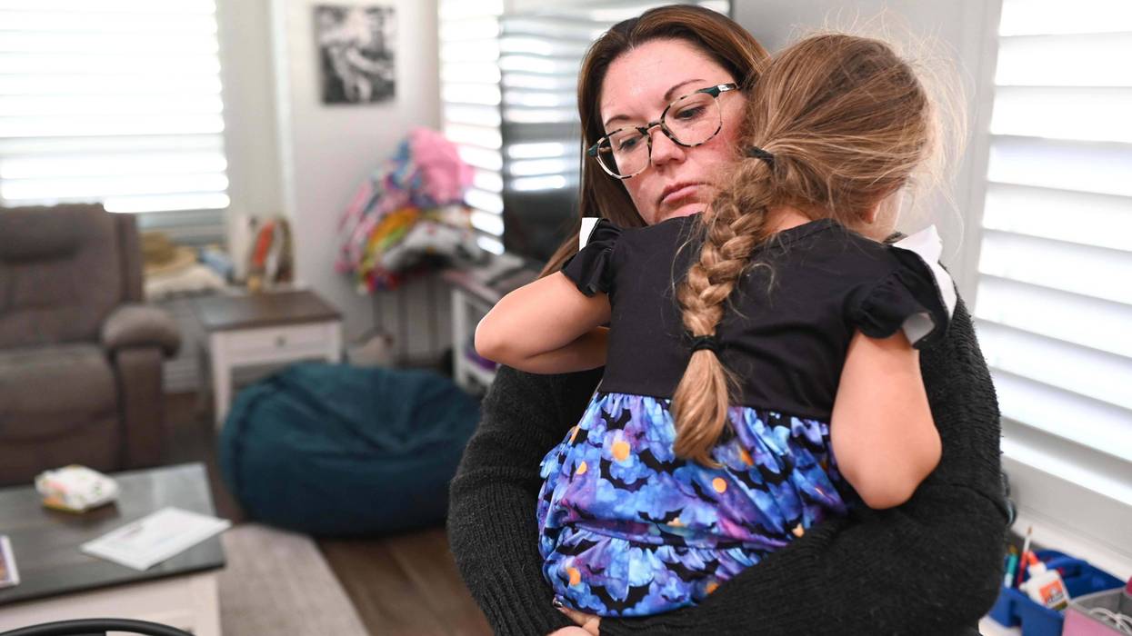 Jennifer Bittner holds her 6-year-old daughter Amelia at their home on Wednesday, Oct. 29, 2025, in Pflugerville, Texas.