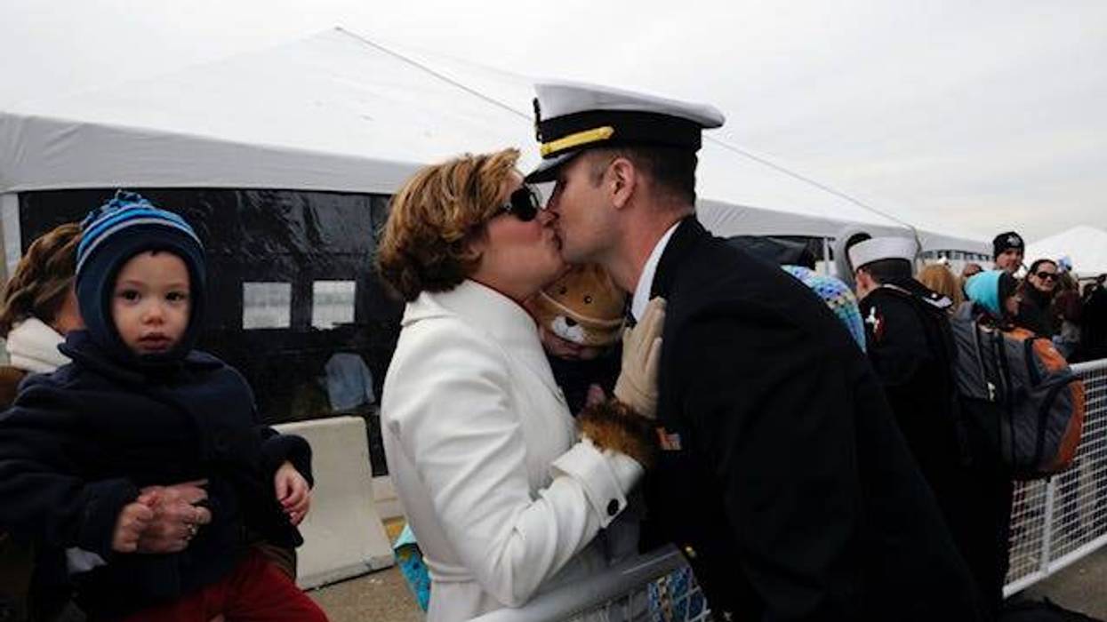 Jenny Lynne Stroup kisses her husband Matthew for the first time after he returns home from a seven-month tour aboard the USS George H.W. Bush in 2011. Photo courtesy of the author.