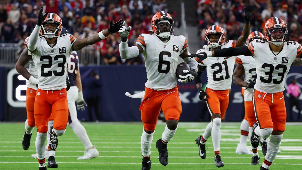 Jeremiah Owusu-Koramoah #6 of the Cleveland Browns celebrates an interception with his teammates during the second quarter against the Houston Texans at NRG Stadium on December 24, 2023 in Houston, Texas.