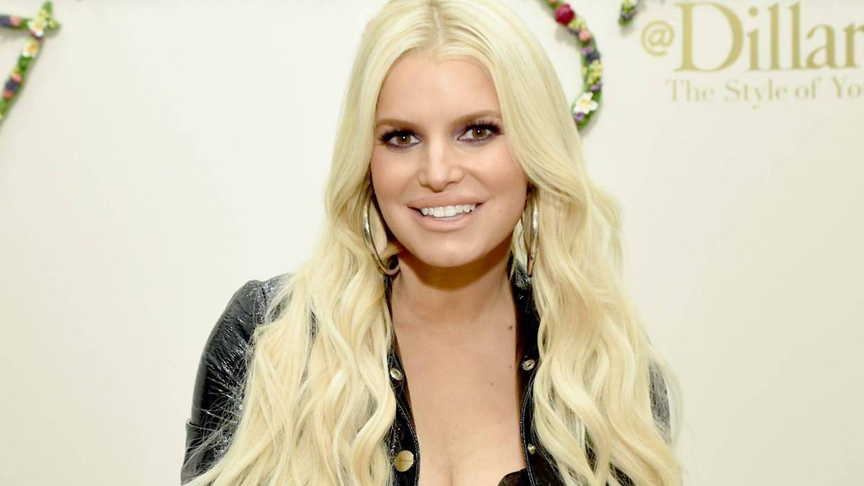 Jessica Simpson signs autographs for fans during a spring style event for army wives and kids