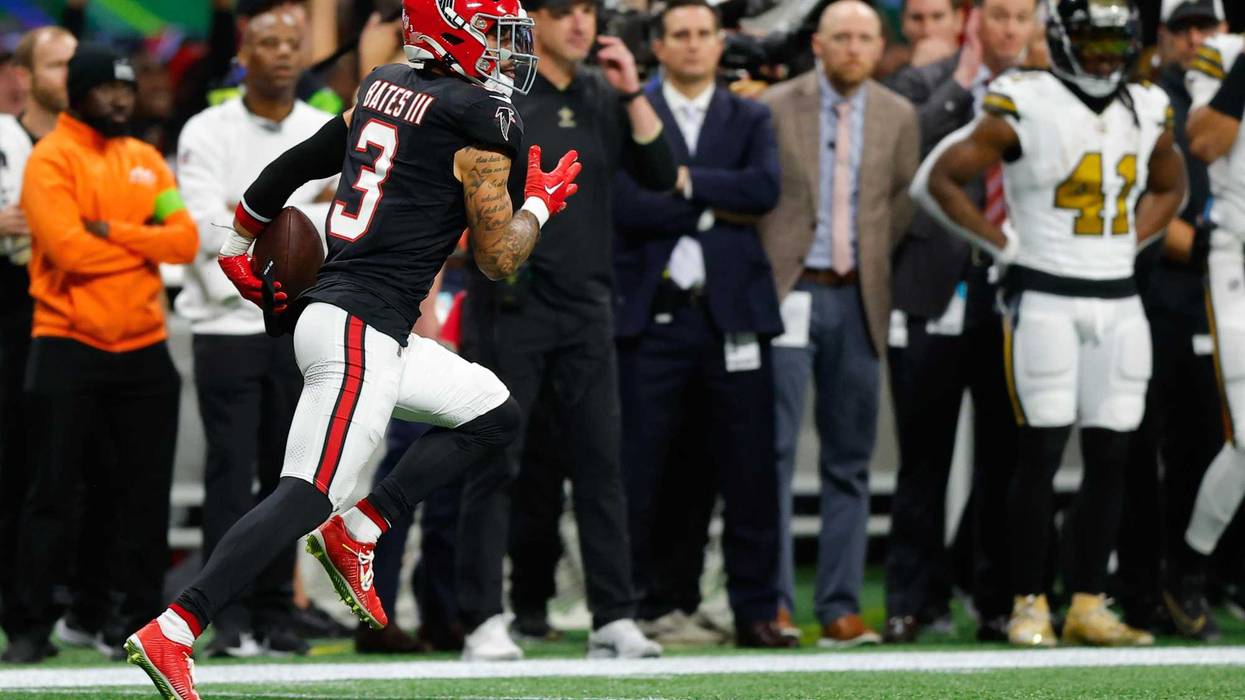 Jessie Bates III #3 of the Atlanta Falcons returns an interception for a touchdown in the first quarter of the game against the New Orleans Saints at Mercedes-Benz Stadium