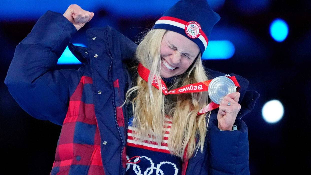 Jessie Diggins (USA) celebrates her silver medal in cross-country skiing women's 30km mass start during the closing ceremony for the Beijing 2022 Olympic Winter Games at Beijing National Stadium.