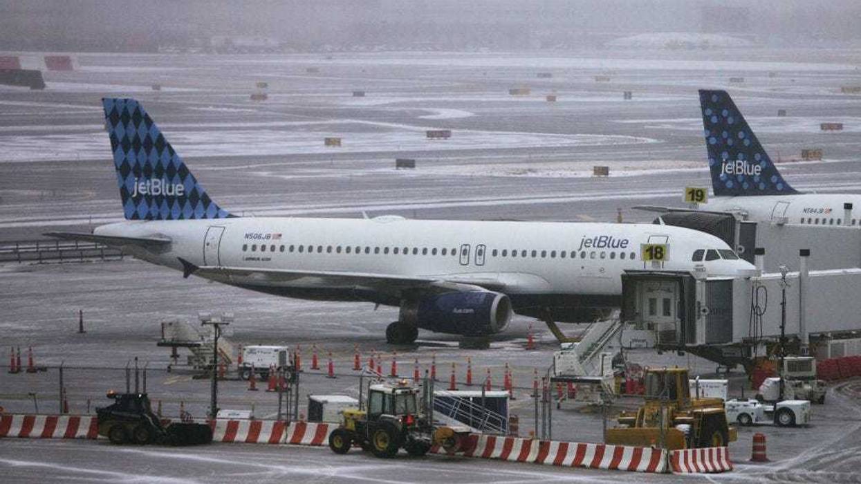 Jet Blue planes sit on the tarmac outside the Jet Blue terminal March 16, 2007 at John F. Kennedy Airport in New York City.
