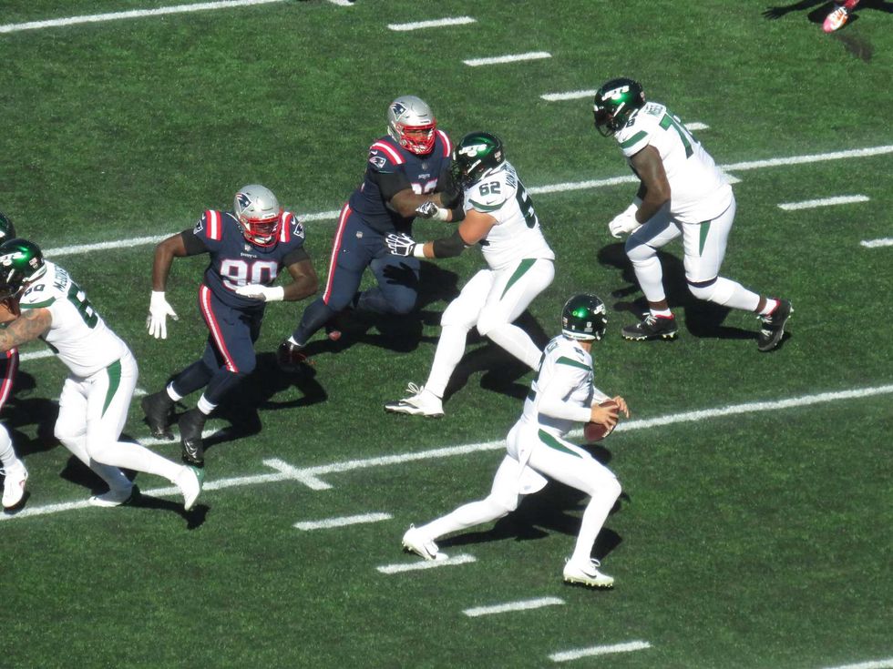 Jets rookie QB Zach Wilson (#2) faced pressure (this time from Davon Godchaux, #90) before leaving the game later with a knee injury, 10/24/21