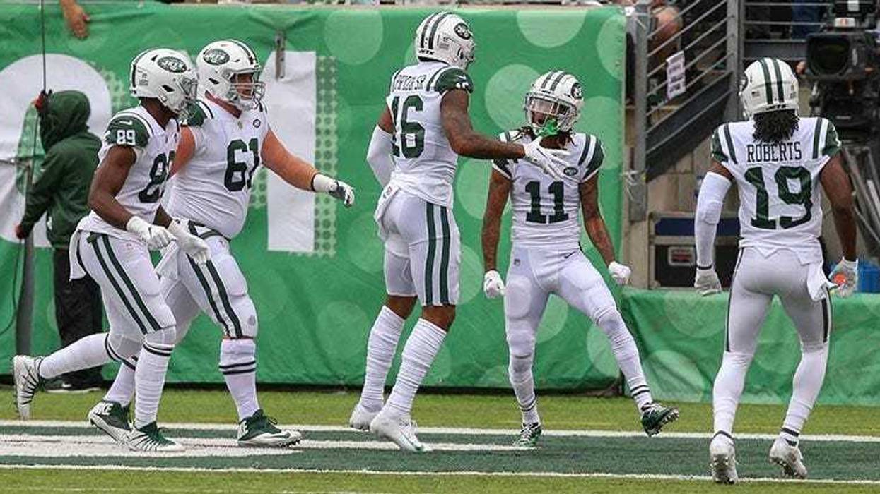 Jets wide receiver Terrelle Pryor celebrates a touchdown with wide receiver Robby Anderson (11) and teammates during the first half against the Indianapolis Colts on Oct. 14, 2018, at MetLife Stadium.