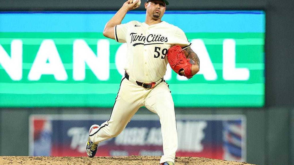 Jhoan Duran #59 of the Minnesota Twins delivers a pitch against the Washington Nationals during the ninth inning at Target Field on July 25, 2025 in Minneapolis, Minnesota.
