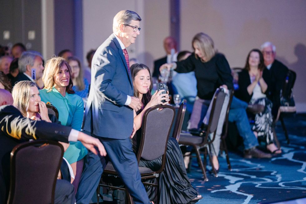 Jim Jackson walks to receive his recognition.
