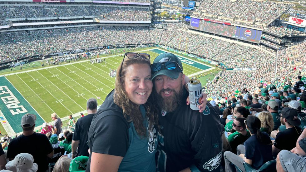 Jim Montgomery with his wife Abby at Lincoln Financial Field