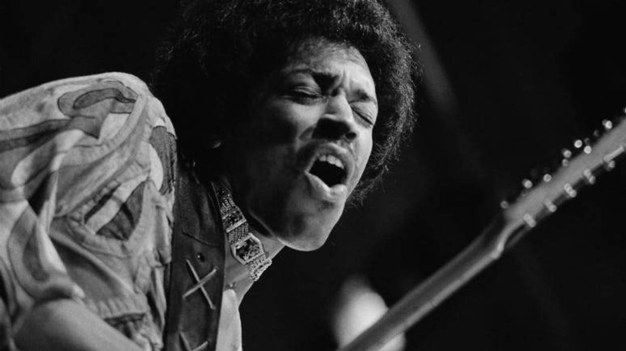 Jimi Hendrix caught mid guitar-break during his performance at the Isle of Wight Festival, August 1970