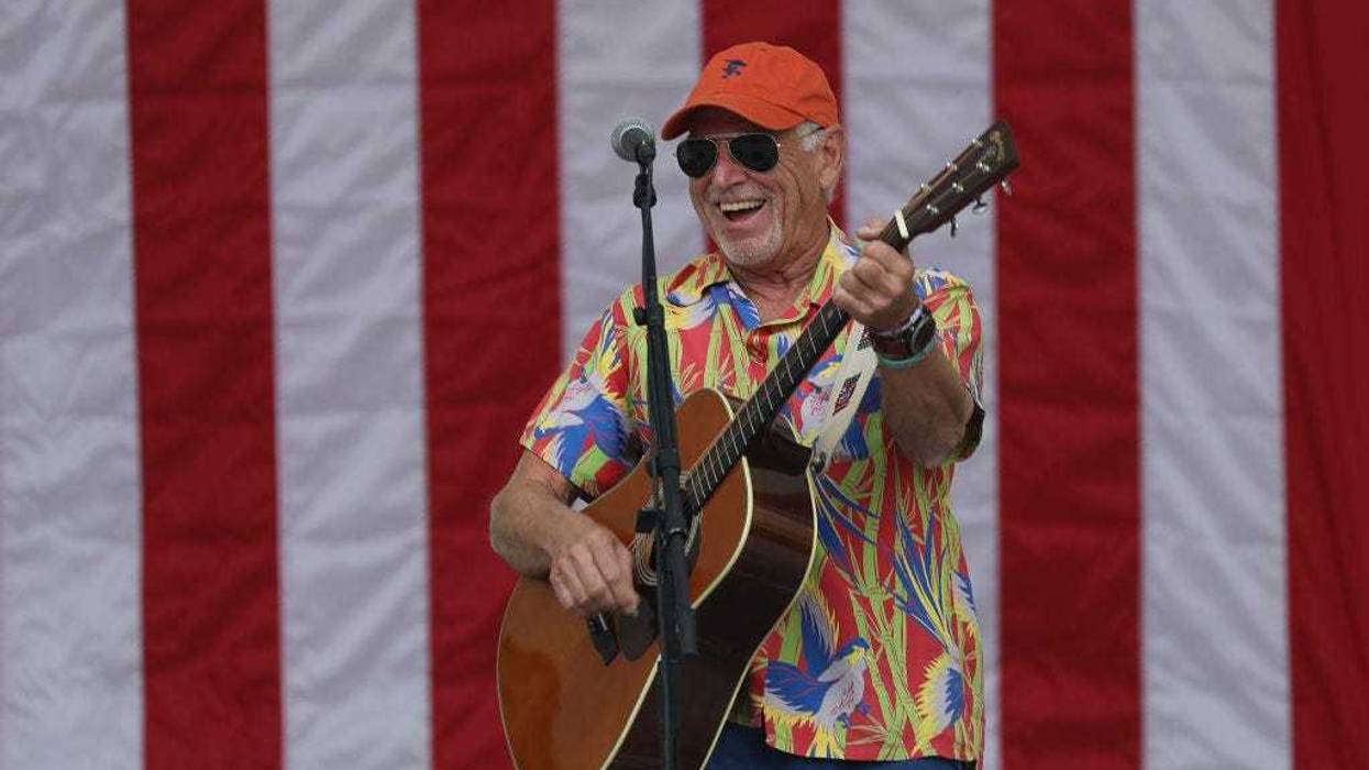 Jimmy Buffett plays a song as he performs at a Get Out the Vote rally for U.S. Senator Bill Nelson (D-FL) and Florida Democratic governor candidate Andrew Gillum at the Meyer Amphitheatre on November 03, 2018 in West Palm Beach, Florida.