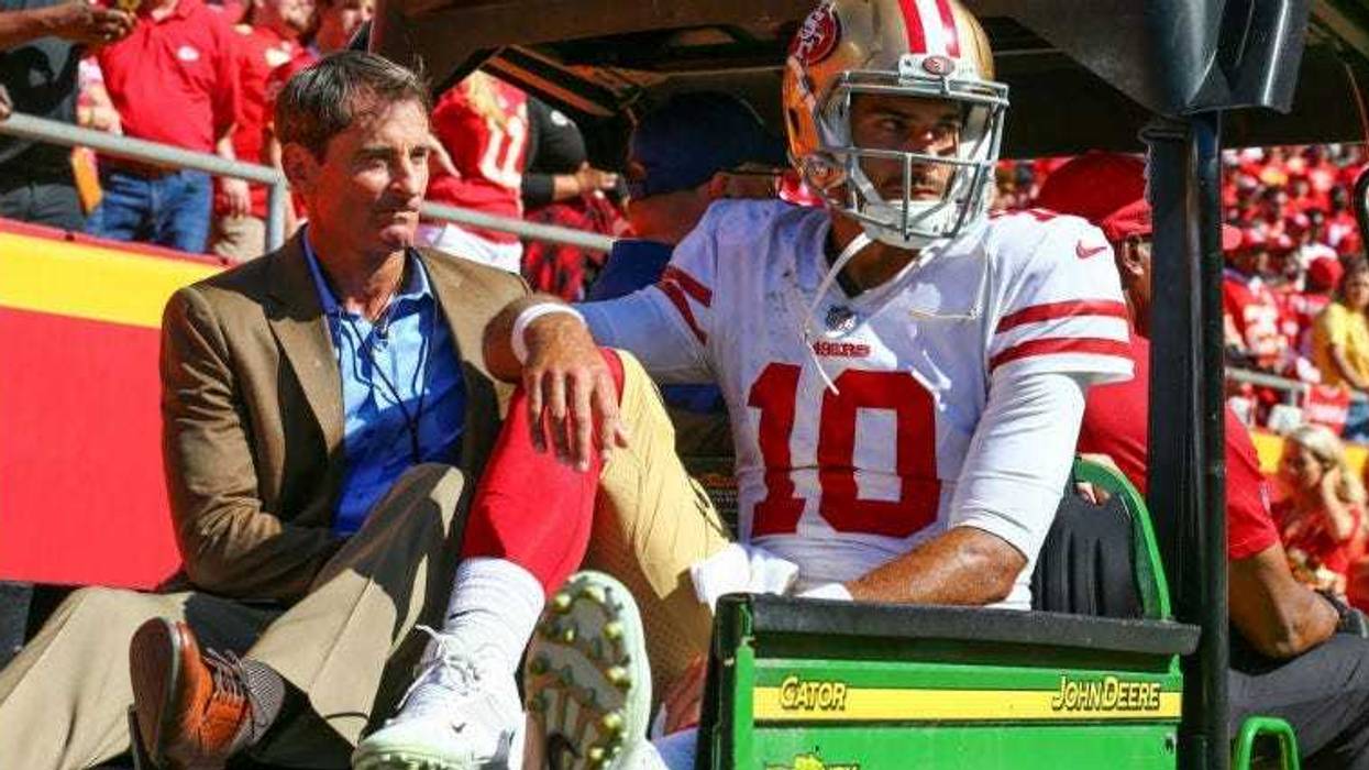 Jimmy Garoppolo is taken off the field after an injury in the second half against the Kansas City Chiefs at Arrowhead Stadium.