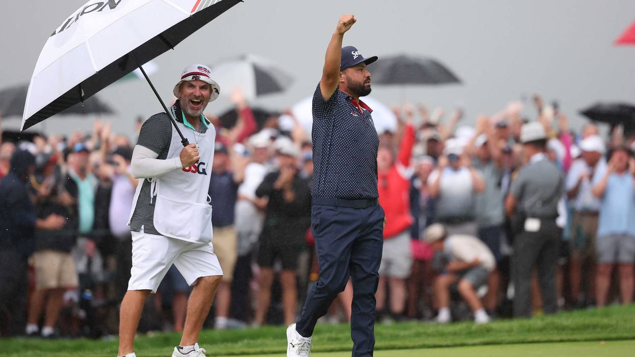 JJ Spaun celebrates after putting on the 18th green to win during the final round of the U.S. Open golf tournament.