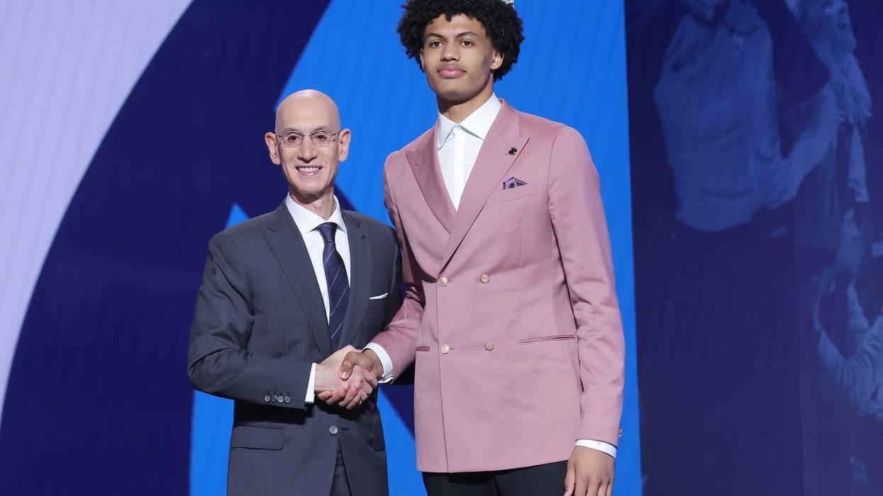 Joan Beringer stands with NBA commissioner Adam Silver after being selected as the 17th pick by the Minnesota Timberwolves in the first round of the 2025 NBA Draft at Barclays Center.