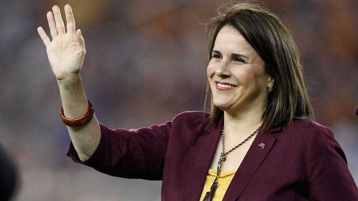 Joan Gabel, president of the University of Minnesota, acknowledges the crowd during the first quarter of the game between the Minnesota Gophers and the South Dakota State Jackrabbits on August 29, 2018 at TCF Bank Stadium in Minneapolis, Minnesota.