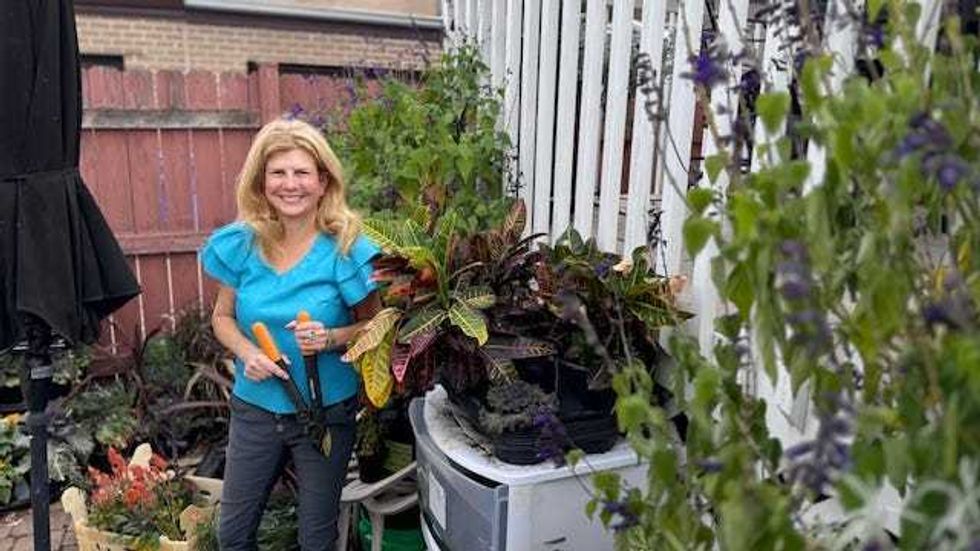 Jodi Richman in garden holding shears