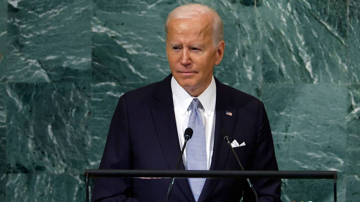 joe biden speaks into a little microphone