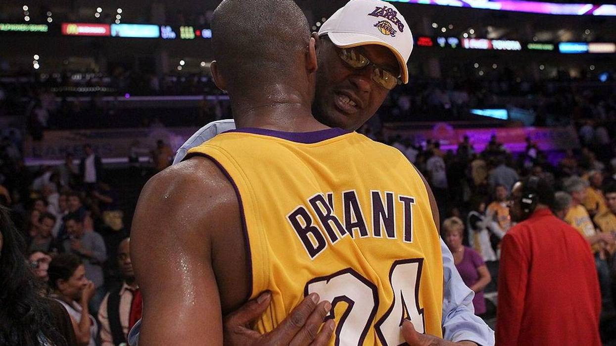 Joe Bryant hugs his son Kobe Bryant #24 of the Los Angeles Lakers after the Lakers 111-103 victory against the Utah Jazz during Game Two of the Western Conference Semifinals of the 2010 NBA Playoffs at Staples Center on May 4, 2010 in Los Angeles, California.