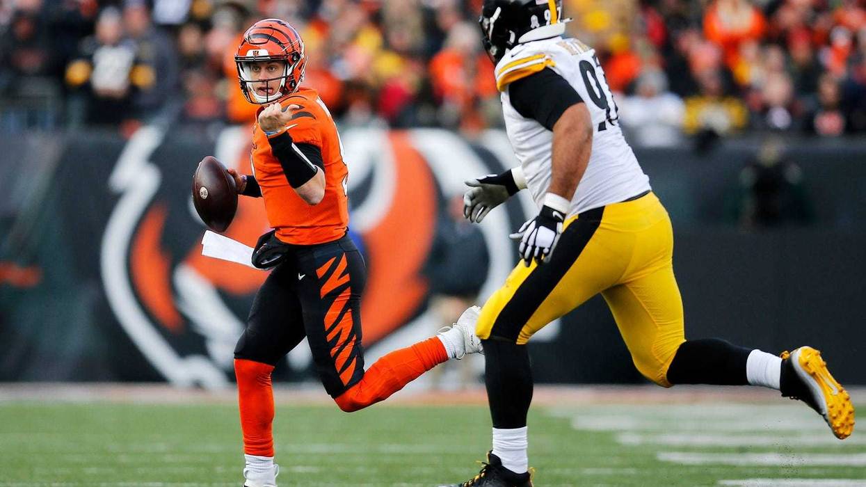 Joe Burrow running from Cam Heyward
