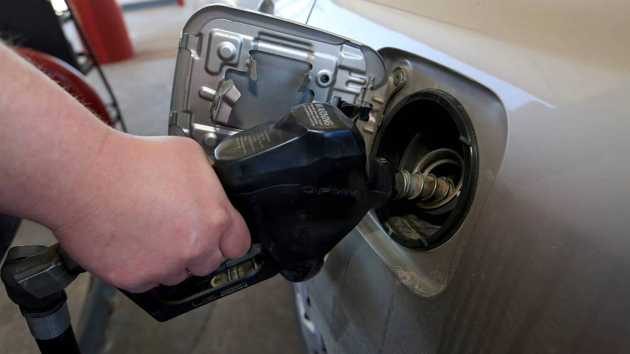 Joe Durazo helps customers who pull into the full service pump area Tuesday morning, March 1, 2022,